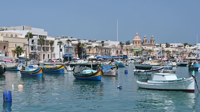 Marsaxlokk - fishing village and colorful luzzu boats. Malta.