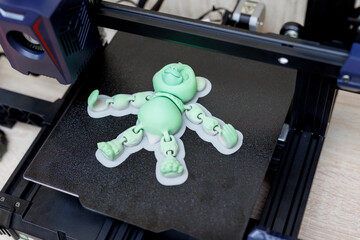 Green panda model on a 3D printer platform. © Studio Peace
