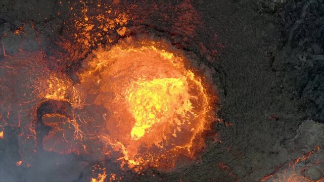 Aerial View of a Fiery, Turbulent Volcano Crater: Molten Lava Lake and Volcanic Eruption Activity