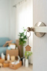 Moving house, relocation. The key was inserted into the door of the new house, inside the room was...