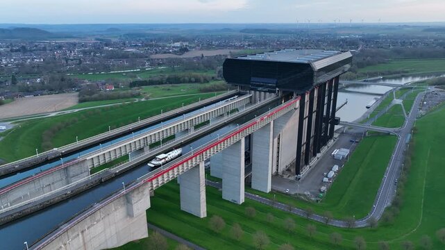 Fixed aerial shot showing a boat moving along the upper canal of the Str&eacute;py-Thieu boat lift in Le Roeulx during blue hour