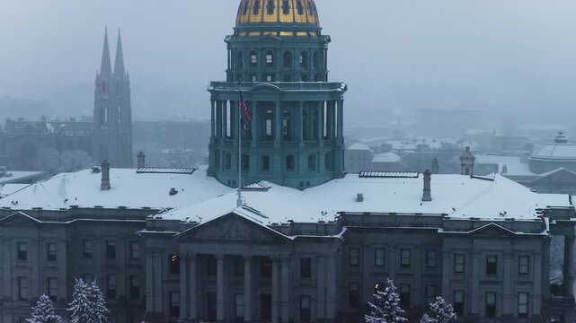Denver Capitol in snow, close up aerial video, Denver, CO 4K