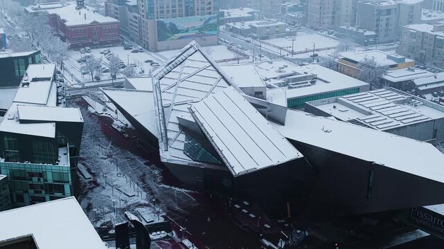 Aerial view of Denver Art Museum during snow storm, aerial video, Denver, CO 4K