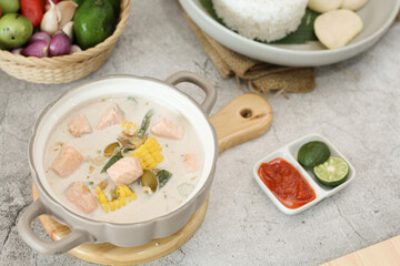Traditional Indonesian Coconut Salmon Soup with Rice