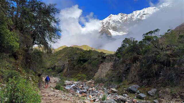 Mount Humantay Peruvian Andes snow capped glacier mountain Salcantay Inca trail trek hiker Peru low fog clouds blue sky rainy dry season Laguna Humantay Soray Anta Cusco region nature landscape pano