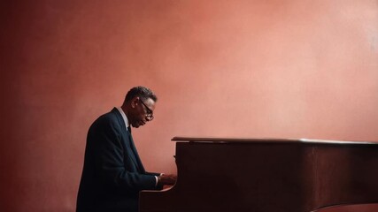 Man playing grand piano in elegant dimly lit studio with emotional focus captured with rich cinematic clarity creating an immersive visual moment that draws viewers into a compelling story f