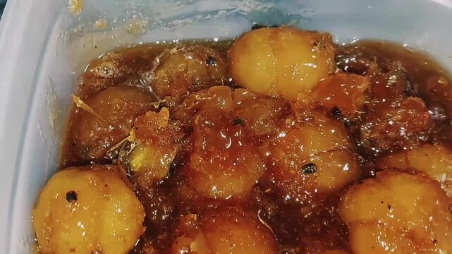 finished aamla murabba showcasing plump preserved gooseberries in syrup