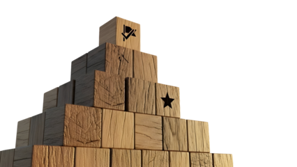 Wooden block pyramid reaching for the top with a success flag and star cutout, symbolizing achievement and goal setting