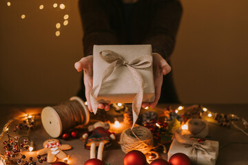 Top view of woman hands holding christmas gift
