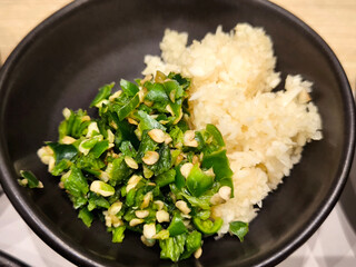 Chili and garlic in a black bowl