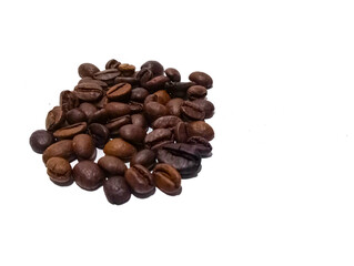 close up of a pile of fresh coffee beans isolated on a white background