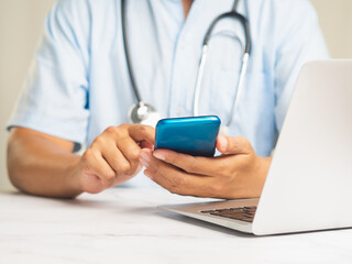 Doctor using smartphone for medical communication.