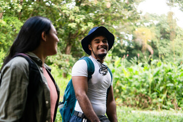 Happy couple enjoying nature walking protecting mental health