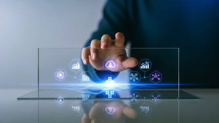 Hand touching futuristic holographic interface on digital tablet