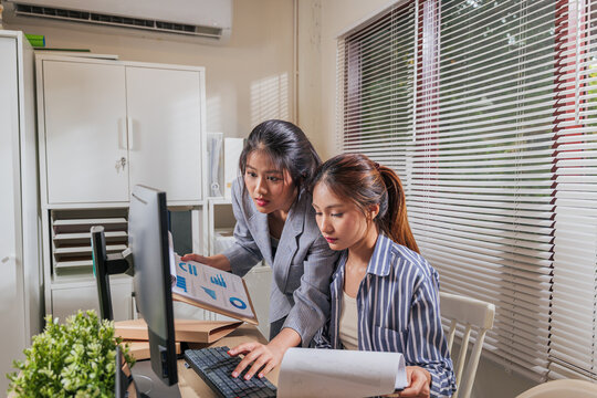 Young women business team work at home office, online learn and collaborate on project, reviewing data charts with computer for successful progress, demonstrating teamwork and professional focus - Powered by Adobe