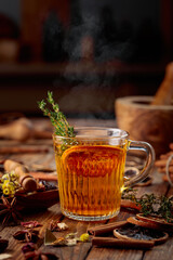Herbal tea with thyme and dried orange slice.