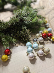 Decorating Christmas wreath. Moody Christmas image, holiday preparations. High quality photo