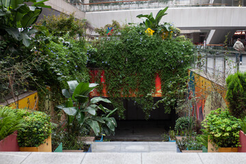 Lush multi-story garden area, part of modern complex in Chengdu, China. Integrating extensive greenery into urban infrastructure. Eco-friendly green design, architectural trend.