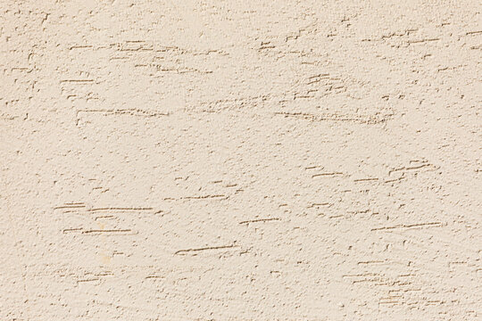 Rough Beige Plaster Wall Texture Close-Up