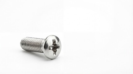 A single silver metal Phillips head machine screw lying on a plain white surface for industrial or hardware concepts.