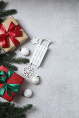 Christmas gift. Top view of image on gray background with space for decoration.
