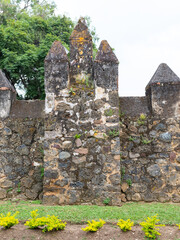 Old worn stone wall with towers. © sandor