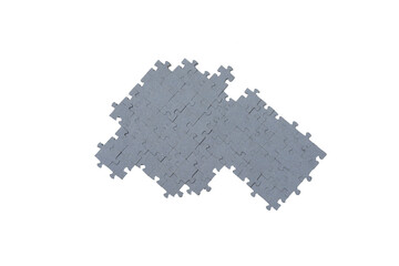 Fototapeta premium Scattered puzzles on a white background with selective focus. 