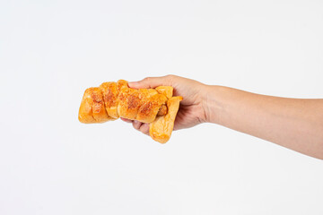 Baked bread stuffed with chicken sausage and hamd on white background