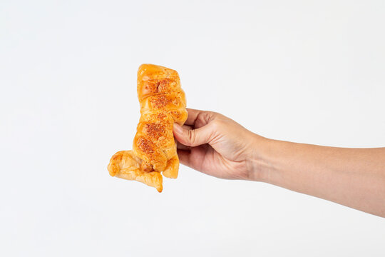 Baked bread stuffed with chicken sausage and hamd on white background