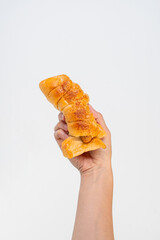 Baked bread stuffed with chicken sausage and hamd on white background