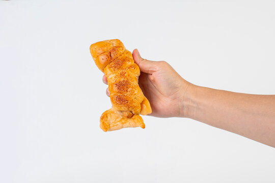Baked bread stuffed with chicken sausage and hamd on white background