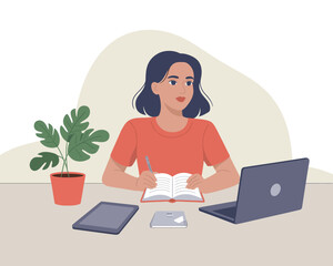 Woman studying and working from home with laptop, tablet, notebook and plant