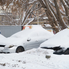 Cars covered with snow in Parking lot