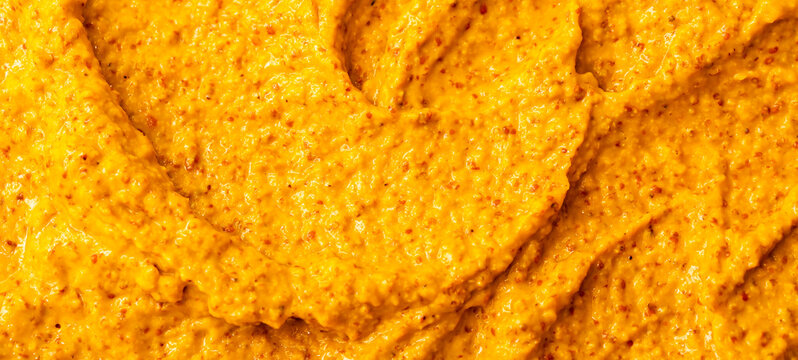 Smoothie of fresh fruits and berries, orange, banana, mango, sea buckthorn, cloudberry. Ice cream texture. Fruit yogurt ice cream. Delicious sweet dessert close-up as a background. - Powered by Adobe