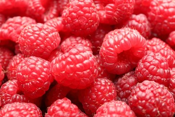 Fresh ripe raspberries as background, closeup view