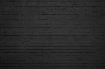 Dunkle Backsteinwand als rustikaler Hintergrund