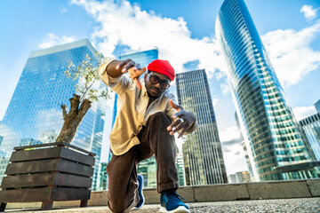 Young black man posing in urban street dance style