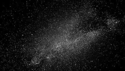 Fototapeta premium A stunning grayscale image of the Milky Way, showcasing a vast expanse of stars and celestial dust