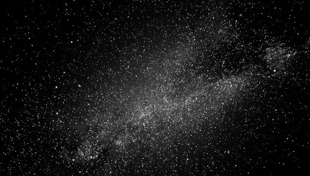 A stunning grayscale image of the Milky Way, showcasing a vast expanse of stars and celestial dust