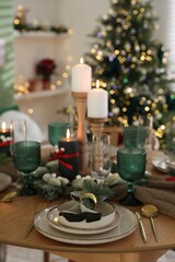 Festive table setting with Christmas decor indoors, closeup