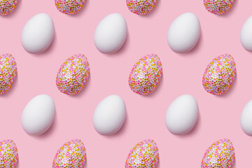White and decorative easter eggs in colorful sequins as minimal trend repeated pattern pastel pink color. Pop art still life sparkling rhinestones eggs, spring easter holiday concept, modern design.