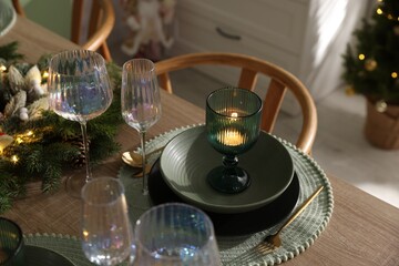 Festive table setting with Christmas decor indoors, closeup