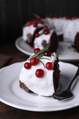 Tasty Christmas cake with cranberries and rosemary served on table, closeup