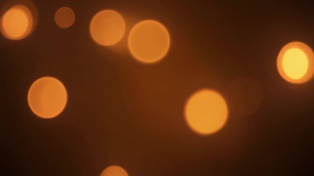 Warm Amber Bokeh Orbs Pulsing Gently Dark Background Cozy Breathing Light Loop