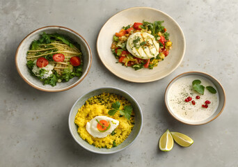 A Culinary Quartet: Four distinct bowls of food, each with its unique flavor profile, are artfully arranged, creating a visual symphony of culinary delight.