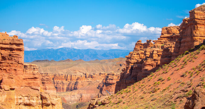 Charyn Canyon, Valley of Castles. The excellence of Kazakhstan. Panorama of natural unusual landscape. The red canyon of extraordinary beauty looks like a Martian landscape.