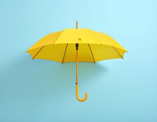 Bright yellow umbrella on light blue background