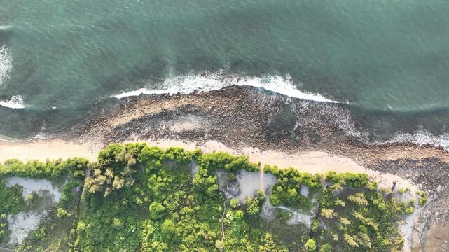 Aerial view of rocky shoreline and turquoise waves at Saint Martin, Teknaf, Cox&rsquo;s Bazar, Bangladesh - 4k aerial video shot