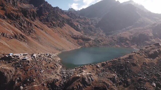A stunning aerial view of Gosaikunda Lake in Solukhumbu shows its sacred blue water set amid rugged Himalayan terrain. The high-altitude scenery highlights the lake&rsquo;s natural beauty.