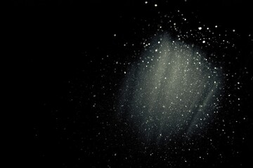 Obraz premium Abstract artwork of illuminated specks against a dark background. Suggests cosmic dust, stars, or particles